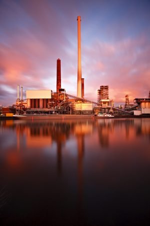 Long exposure shot of a refinery with intense colors and reflection.
